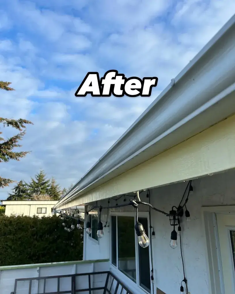 After: the same gutter face washed bright white under a blue sky